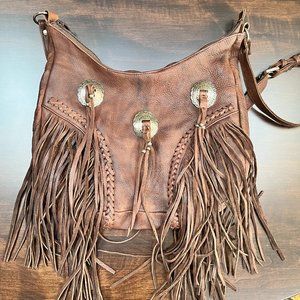 Handmade Western Style 100% Leather bag with Concho and Fringe detail.